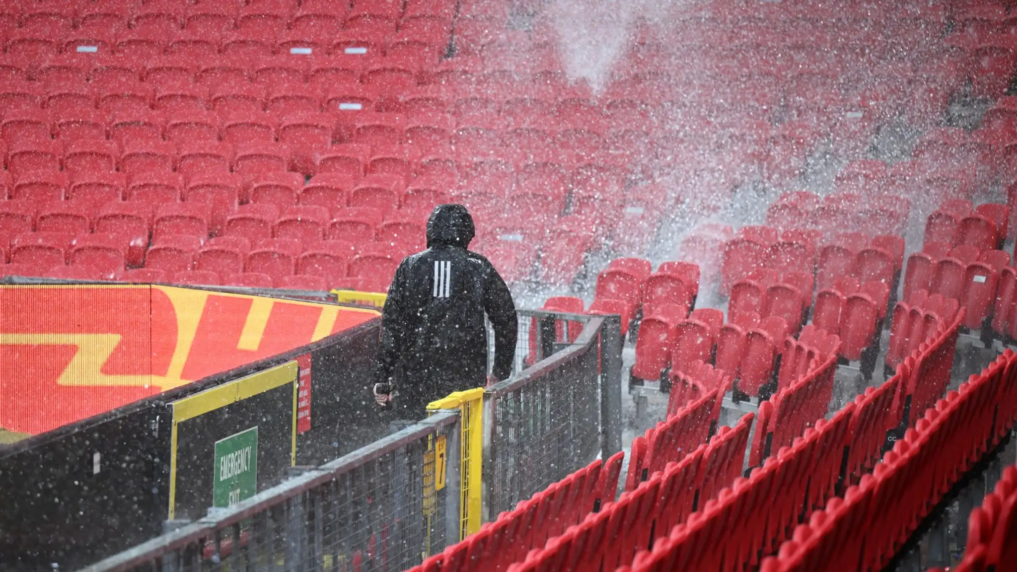 VIDEO: Old Trafford is flooded! Shocking video shows impact of downpour as bemused Manchester United fans watch water gush through stadium's roof