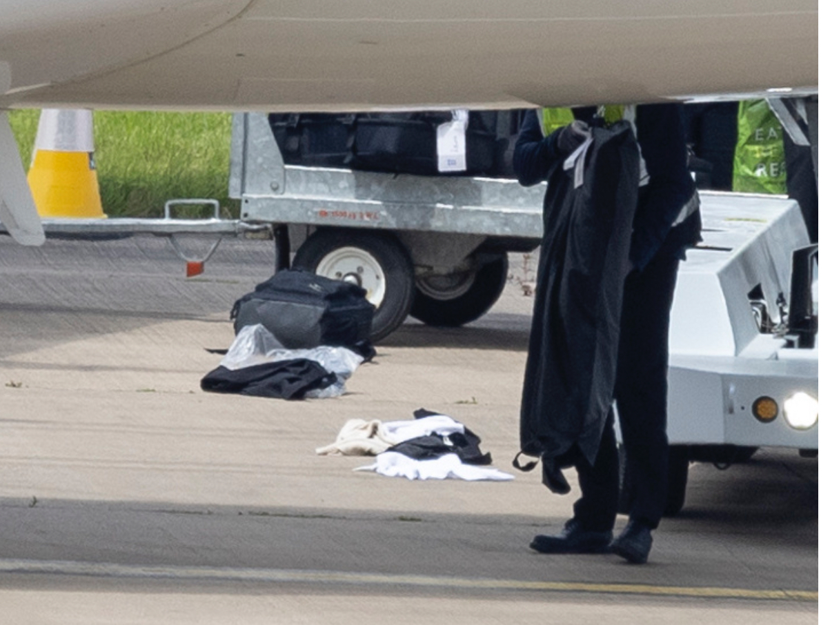 England stars’ clothes spill onto Airport tarmac as baggage handlers drop bags